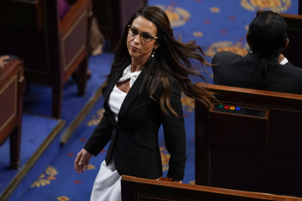 Rep. Lauren Boebert, R-Colo., walks in the House chamber as the House meets for a second day to elect a speaker and convene the 118th Congress in Washington, Wednesday, Jan. 4, 2023. (AP Photo/Andrew Harnik)