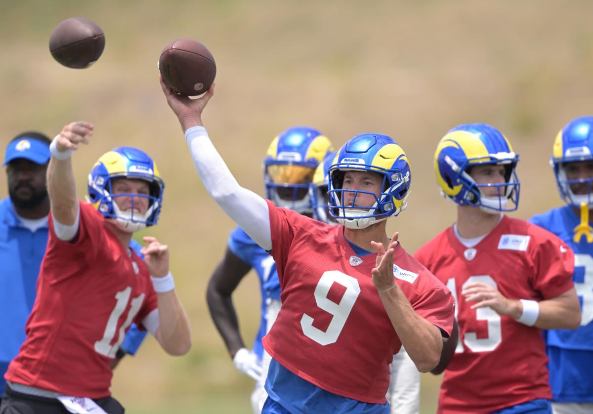 Los Angeles Rams quarterback Stetson Bennett (13) looks to throw a pass as  quarterback Matthew Stafford (9) watches him at the NFL football team's  training camp, Saturday, July 29, 2023, in Irvine