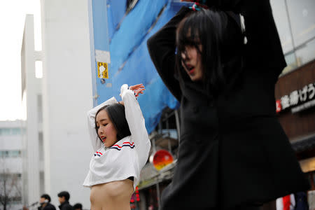 Japanese Yuuka Hasumi, 17, and Ibuki Ito, 17, also from Japan, who want to become K-pop stars, perform during their street performance in Hongdae area of Seoul, South Korea, March 21, 2019. REUTERS/Kim Hong-Ji