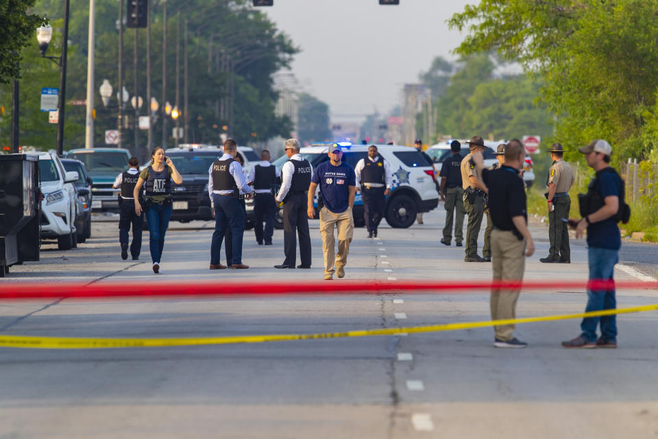 Chicago police and ATF agents work the scene of a shooting on South Ashland Avenue near West 118th Street next to Interstate 57, Wednesday, July 7, 2021. Police say three undercover law enforcement officers were shot and wounded while driving onto an expressway on Chicago’s South Side. (Vashon Jordan Jr./Chicago Tribune via AP)