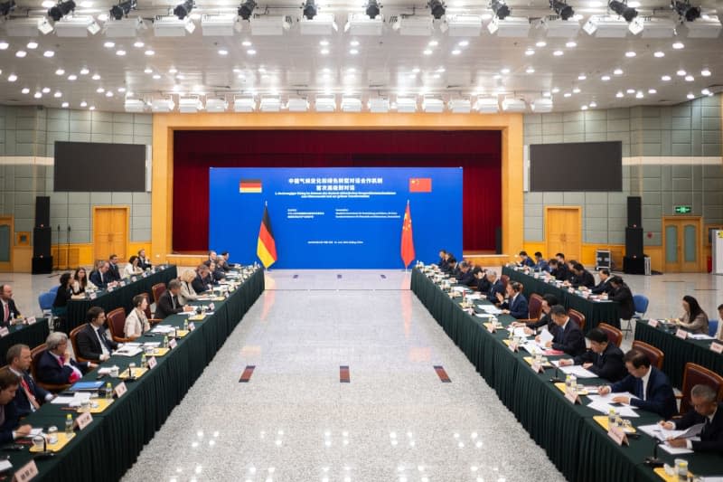 Robert Habeck (L), German Minister of Economic Affairs and Climate Protection, speaks with Zheng Shanjie, Chairman of the National Reform and Development Commission (NDRC), during the Sino-German Climate and Transformation Dialogue with the National Reform and Development Commission as part of a visit to the People's Republic of China.  Sebastian Christoph Gollnow/dpa