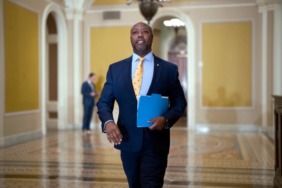 Sen. Tim Scott, R-S.C., walks past the chamber during the vote to confirm former Los Angeles Mayor Eric Garcetti as the next ambassador to India at the Capitol in Washington, Wednesday, March 15, 2023.