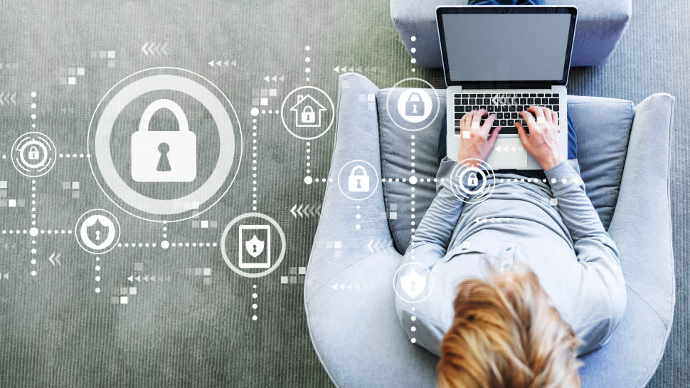  A padlock icon next to a person working on a laptop. 