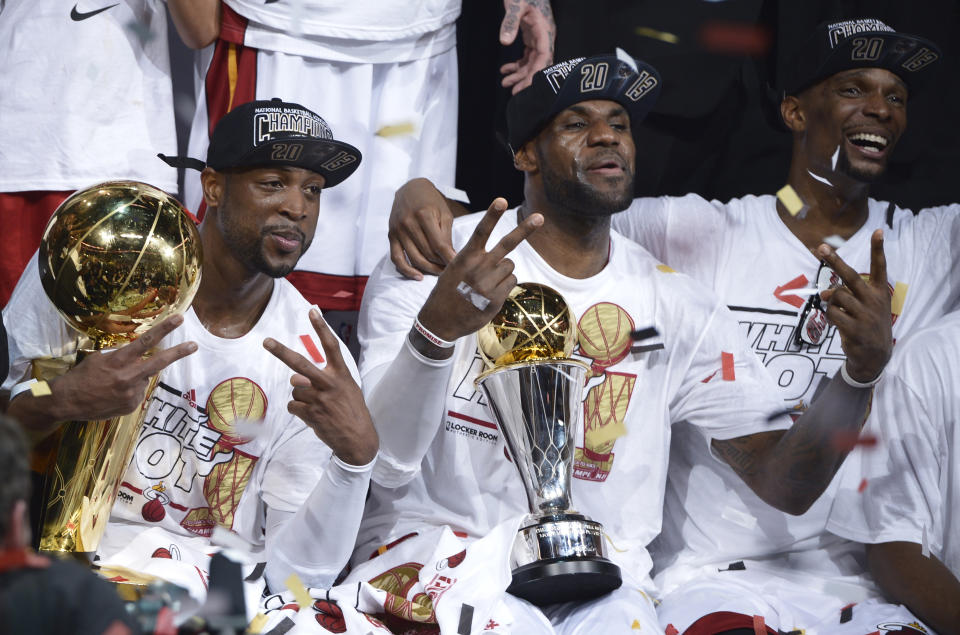 Dwyane Wade, LeBron James and Chris Bosh celebrate after the Miami Heat won the 2013 NBA Finals over the San Antonio Spurs. (BRENDAN SMIALOWSKI/AFP via Getty Images)