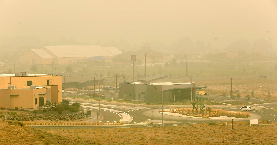 A motorist navigates the roundabout onHildebrand Boulevard near Zintel Way in September 2020 when the air was so smoky that air quality was rated as “hazardous,” the worst in a decade.