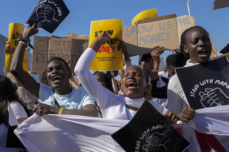 Demonstrators participate in a Fridays for Future protest calling for money for climate action at the COP27 U.N. Climate Summit, Friday, Nov. 11, 2022, in Sharm el-Sheikh, Egypt. (AP Photo/Peter Dejong)