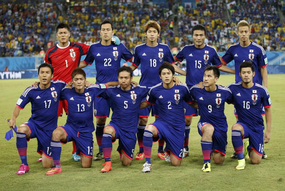 Japan's national soccer team poses ahead of their 2014 World Cup Group C soccer match against Greece at the Dunas arena in Natal June 19, 2014. REUTERS/Toru Hanai