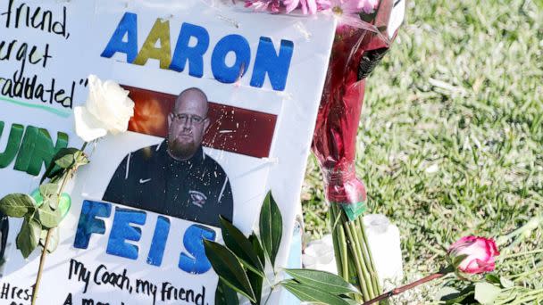 PHOTO: A tribute to coach Aaron Feis is left at the base of a white cross at Pine Trails Park in Parkland, Fla., Feb. 16, 2018.  (Amy Beth Bennett/AP, FILE)