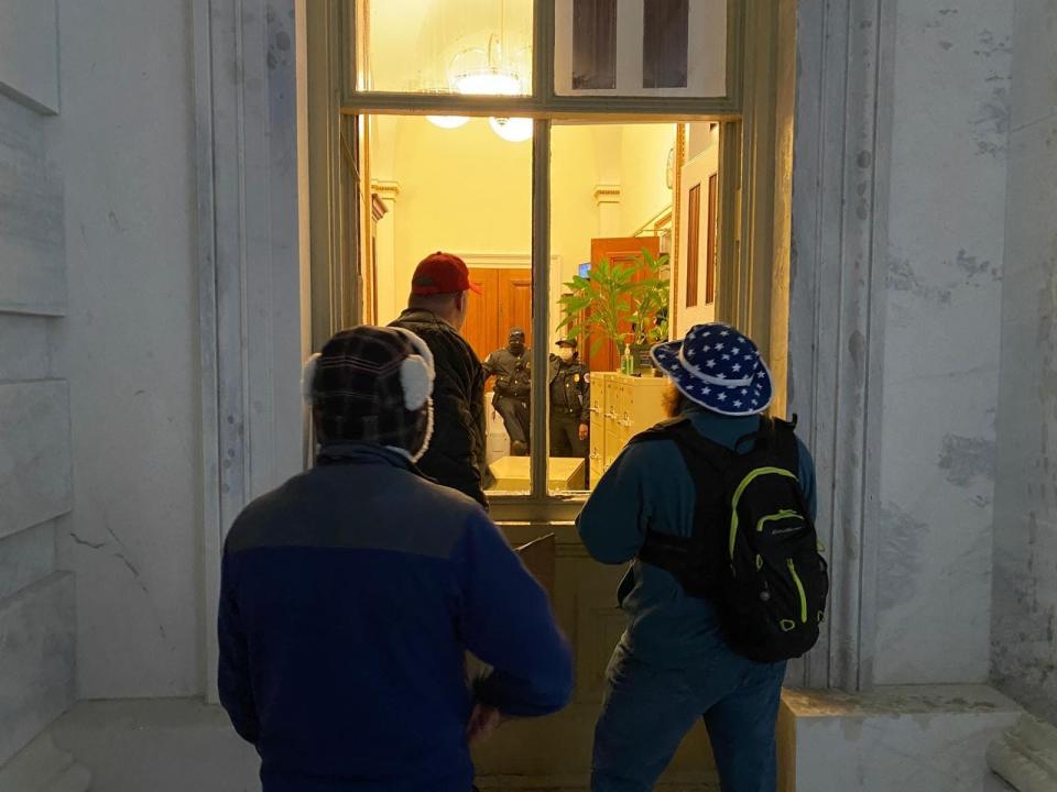 Trump supporters attempt to enter the Capitol building