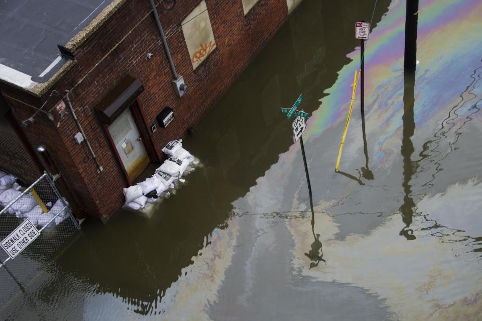 A street and business are flooded as a result of Hurricane Sandy on Tuesday, Oct. 30, 2012 in Hoboken, NJ. (AP Photo/Charles Sykes)