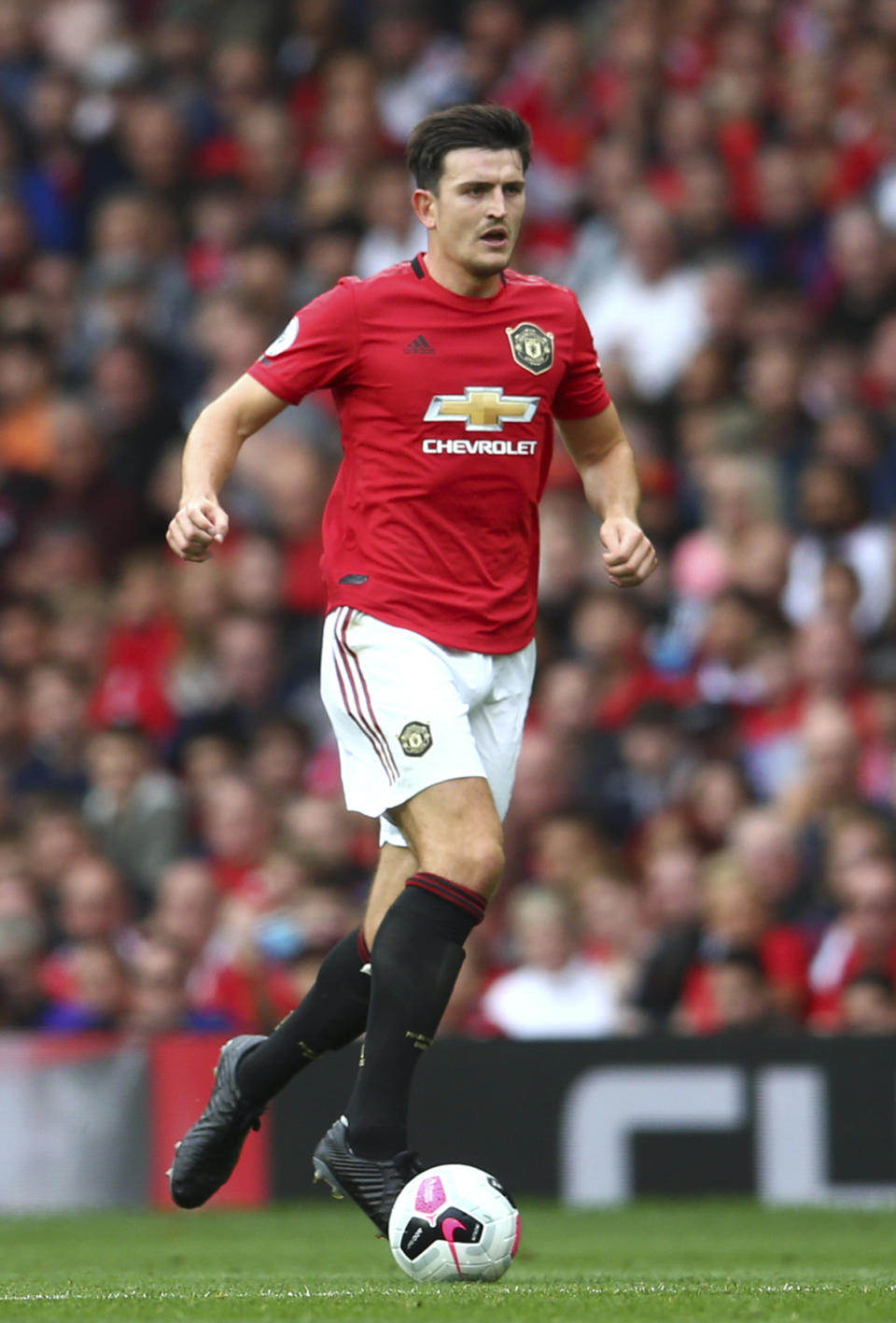 Manchester United's Harry Maguire controls the ball during the English Premier League soccer match between Manchester United and Chelsea at Old Trafford in Manchester, England, Sunday, Aug. 11, 2019. (AP Photo/Dave Thompson)