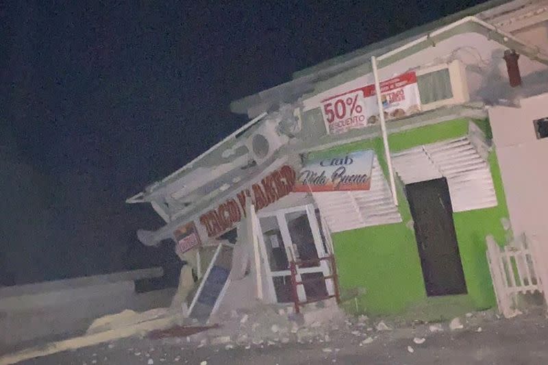 A shop is seen collapsed on its foundation after an earthquake in Guanica