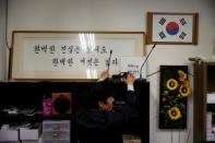 A cable typed voice recorder is pictured as Jung Sung-churl, CEO of Auto Jungbo Co., demonstrates during his interview in Seoul