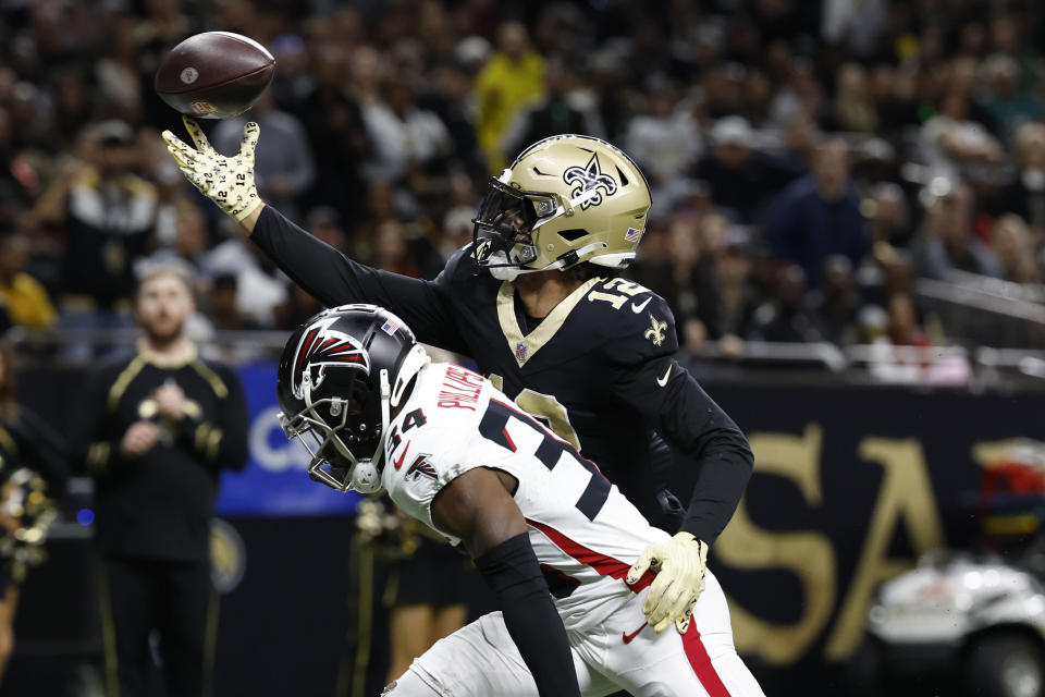 New Orleans Saints wide receiver Chris Olave (12) makes a touchdown catch against Atlanta Falcons cornerback Clark Phillips III (34) in the second half of an NFL football game in New Orleans, Sunday, Jan. 7, 2024. (AP Photo/Butch Dill)