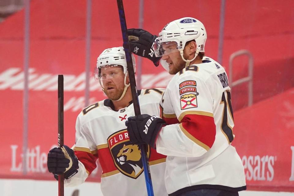 Florida Panthers right wing Patric Hornqvist, left, is congratulated by center Aleksander Barkov during the first period of an NHL hockey game against the Detroit Red Wings, Saturday, Jan. 30, 2021, in Detroit.