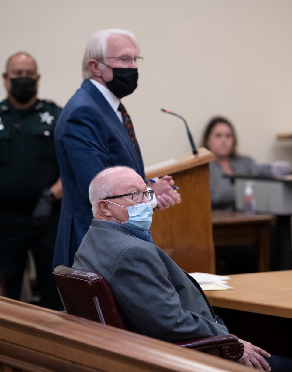 Former Gulf Breeze Mayor Ed Gray, bottom, listens during sentencing at the Santa Rosa County Court House in Milton on August 24, 2021. Gray pleaded no contest to eight counts of video voyeurism, one count of illegal interception of communications, one count of illegally installing a tracking device and one count of stalking. In April 2023, the court vacated his five year prison sentence because the judge gave him a stiffer penalty than what Gray expected per his plea deal.