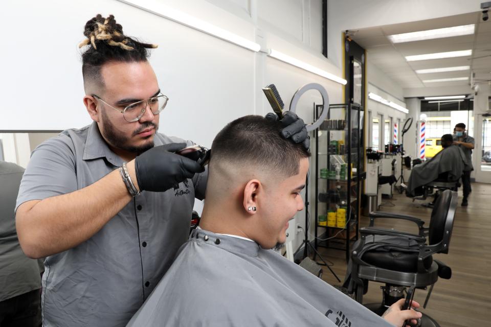 David Marulanda, co-owner of Authentic Hair Studio, gives Santiago Garcia, 22, of Long Island City, a hair cut Jan. 20, 2022 in White Plains. Marulanda started cutting hair for classmates as a teenager in the Bronx. Now, he is the official barber for the USA MenÕs National Soccer Team and cuts hair for players on the New York Knicks, Yankees, Rangers and NYCFC.