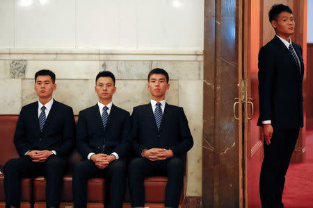 Security personnel take their positions at the Great Hall of the People during the opening session. REUTERS/Damir Sagolj
