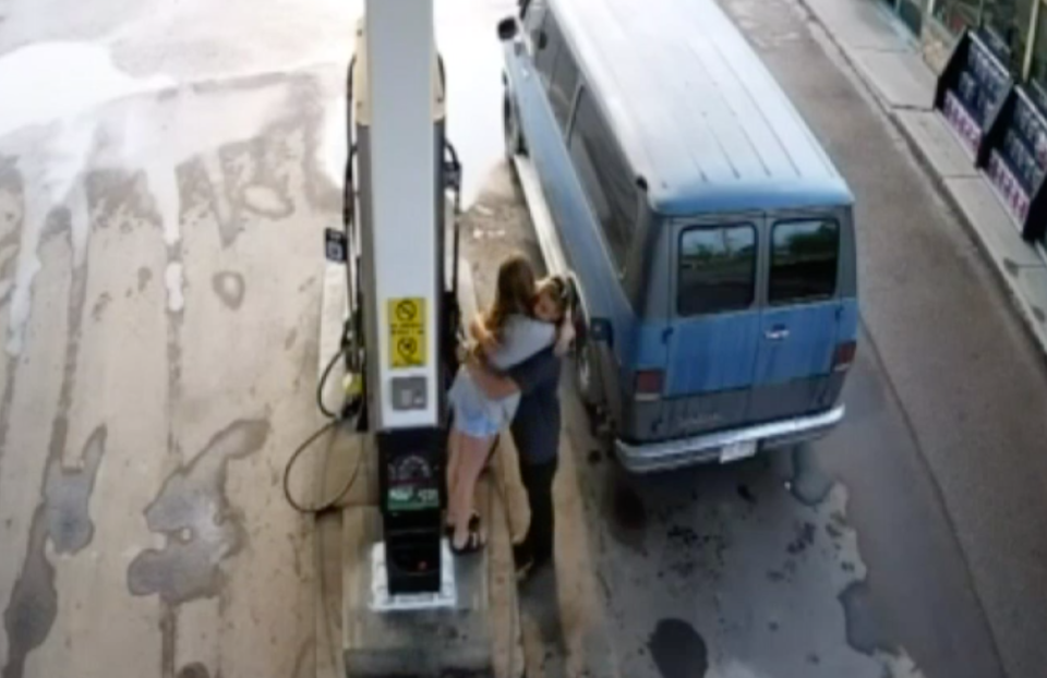 Mr Fowler and Ms Deese embrace at the Fort Nelson service station. Source: RCMP