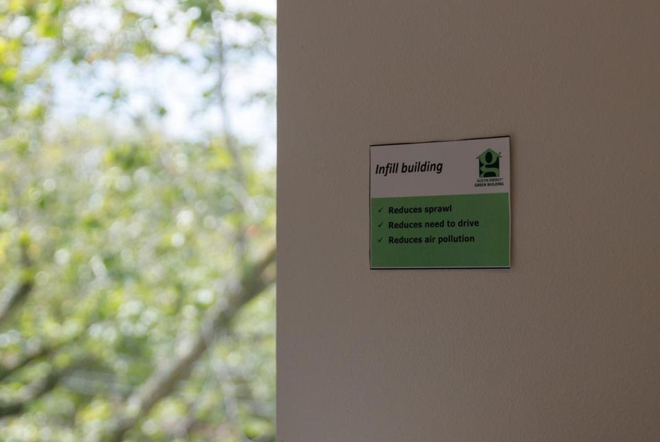 A placard displayed on a wall during an open house describes the ecological benefits of infill building at 4425 Jester Drive, Unit 1 on Sept. 16, 2023. The newly constructed building, located near downtown Austin, is one of two duplex units built on a quarter-acre lot.