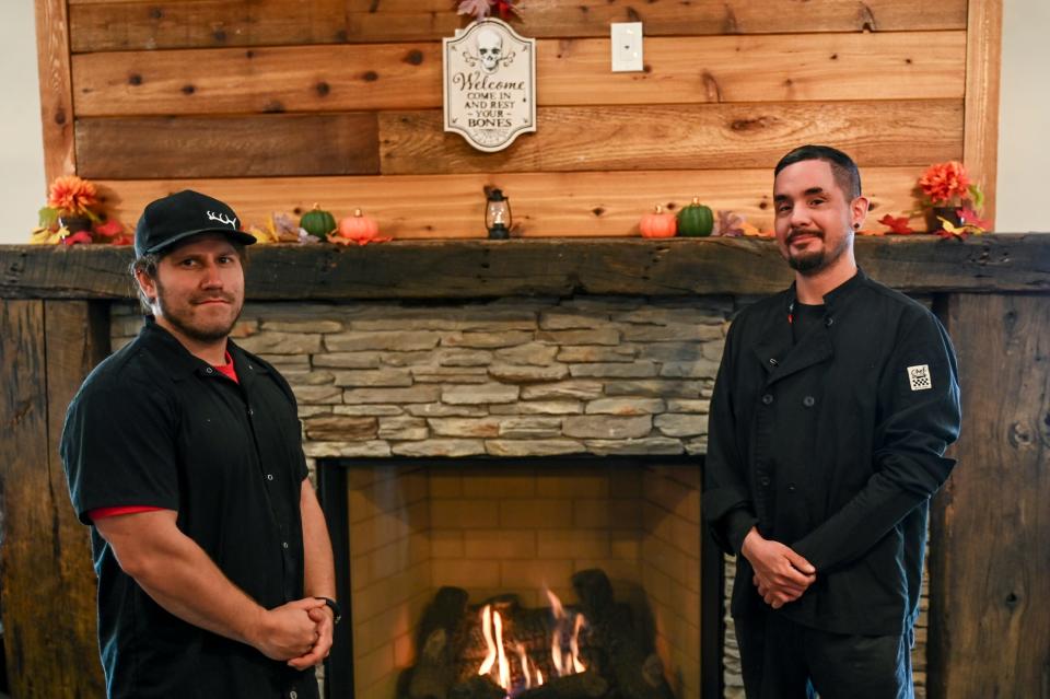 Arms & Embers Grill owner Jordan Rivas, left, and head chef Zhaawosh Bardy inside the restaurant on Wednesday, Nov. 22, 2023, in Grand Ledge.