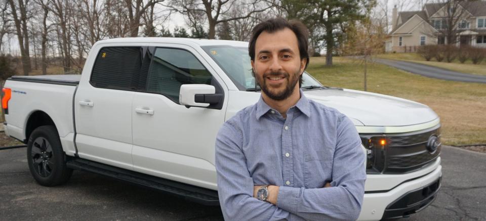 Anthony Magagnoli, human factors and lifestyle attributes engineer at Ford Motor Co., analyzed towing testing for the all-electric 2022 F-150 Lightning in extreme conditions. He is seen here outside his home in Dexter on March 22, 2022.