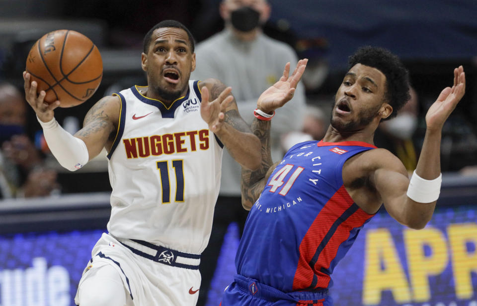 Denver Nuggets guard Monte Morris (11) drives to the basket against Detroit Pistons forward Saddiq Bey (41) in the second quarter of an NBA basketball game in Denver, Tuesday, April 6, 2021. (AP Photo/Joe Mahoney)