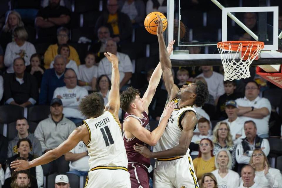 Wichita State’s Quincy Ballard blocks a shot by Southern Illinois in the first half of Saturday night’s game at Koch Arena. Travis Heying/The Wichita Eagle