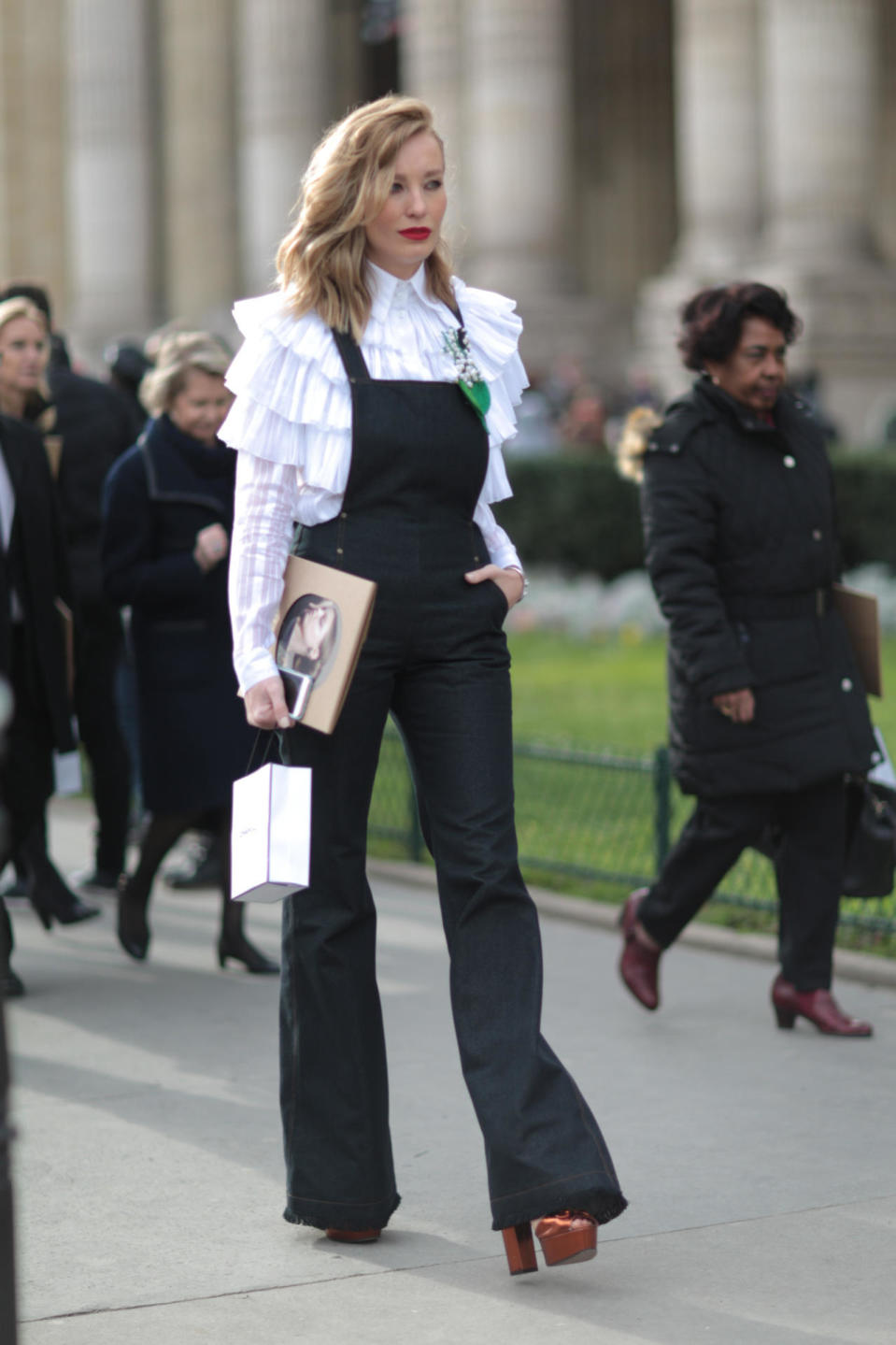 A street style start in denim flare overalls at the Chanel spring/summer 2016 haute couture show in Paris. 