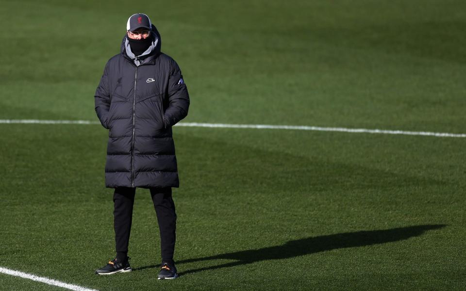 Jurgen Klopp in snood and big jacket - GETTY IMAGES