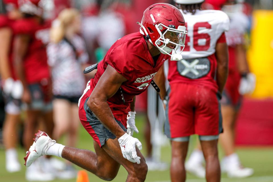 D.J. Graham (9) runs drills during an OU football practice in Norman, Okla., on Monday, Aug. 7, 2023.