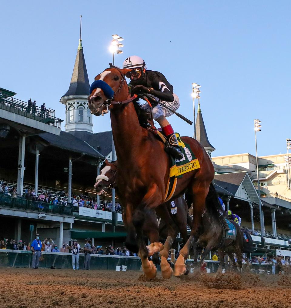 Authentic, with John Velazquez aboard, wins the 2020 Kentucky Derby on Sept. 5 with a small audience of onlookers. The race was delayed from its normal date on the first Saturday in May because of the pandemic.