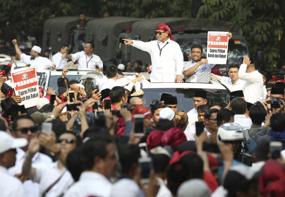 Indonesian presidential candidate Prabowo Subianto, center, greets to his supporters after formal registration as candidate for the 2019 presidential election in Jakarta, Indonesia. Friday, Aug. 10, 2018. He is running with businessman and deputy Jakarta governor Sandiaga Salahuddin Uno. Both officially registered as candidates after Friday prayers. (AP Photo/Achmad Ibrahim))