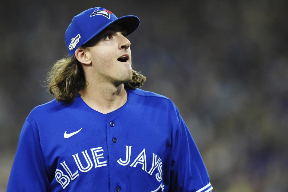 Toronto Blue Jays starting pitcher Kevin Gausman looks to the fans after being taken out during the sixth inning of Game 2 of a baseball AL wild-card playoff series against the Seattle Mariners, Saturday, Oct. 8, 2022, in Toronto. (Nathan Denette/The Canadian Press via AP)