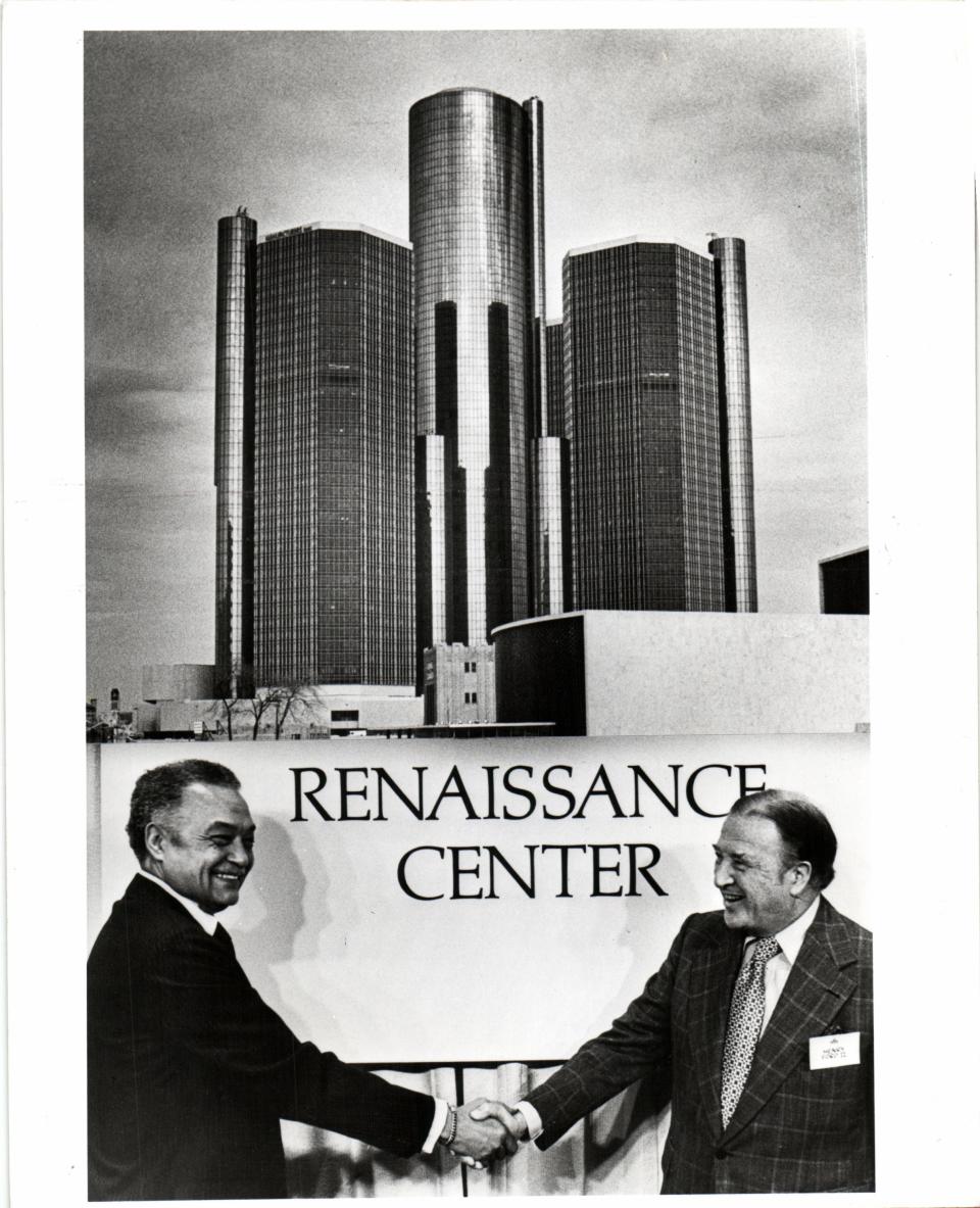 Detroit Mayor Coleman Young and Henry Ford II shake hands during the dedication ceremony of the Renaissance Center in Detroit in 1977, which featured champagne, cookies in the shape of the towers and an appearance by Bob Hope during a black-tie event.