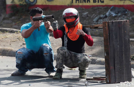 A demonstrator fires a homemade mortar towards riot police during a protest over a controversial reform to the pension plans of the Nicaraguan Social Security Institute (INSS) in Managua, Nicaragua April 21, 2018. REUTERS/Oswaldo Rivas