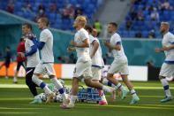 Finnish players warm up prior to the Euro 2020 soccer championship group B match between Russia and Finland at the Saint Petersburg stadium, in St. Petersburg, Russia, Wednesday, June 16, 2021. (AP Photo/Dmitri Lovetsky, Pool)