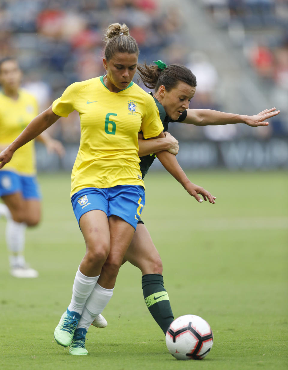 Brazil defender Tamires (6) and Australia forward Hayley Raso (16) vie for the ball during the first half of a Tournament of Nations soccer match in Kansas City, Kan., Thursday, July 26, 2018. (AP Photo/Colin E. Braley)