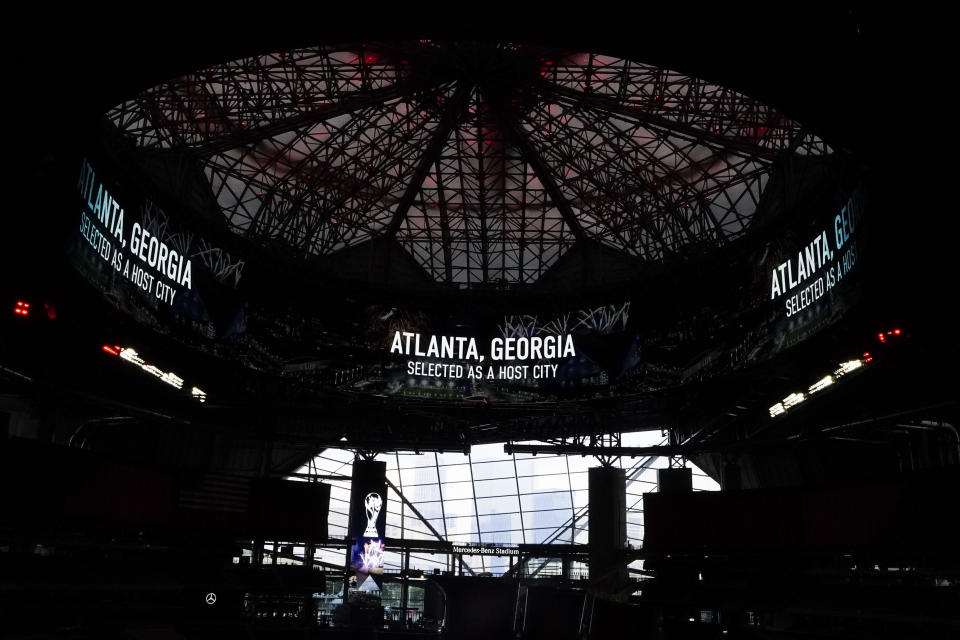 An announcement at Mercedes-Benz Stadium indicates that FIFA has selected Atlanta as a 2026 soccer World Cup host city, Thursday, June 16, 2022, in Atlanta. (AP Photo/Brynn Anderson)