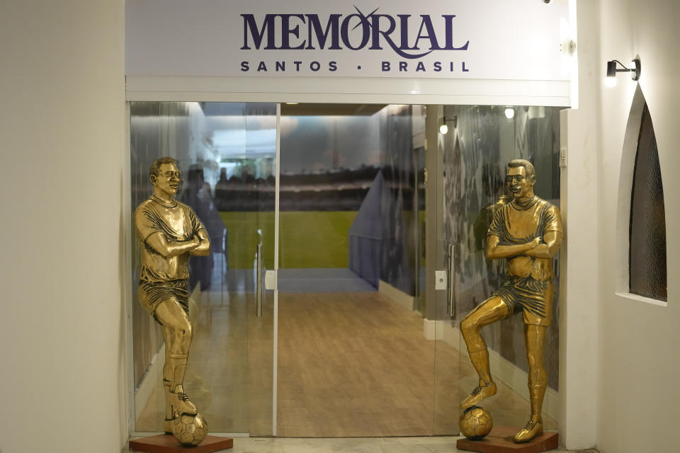 The entrance to the mausoleum of late Brazilian soccer great Pele features statues of him, before his coffin is placed inside at Necropole Ecumenica Memorial Cemetery in Santos, Brazil, Tuesday, Jan. 3, 2023. (AP Photo/Andre Penner)