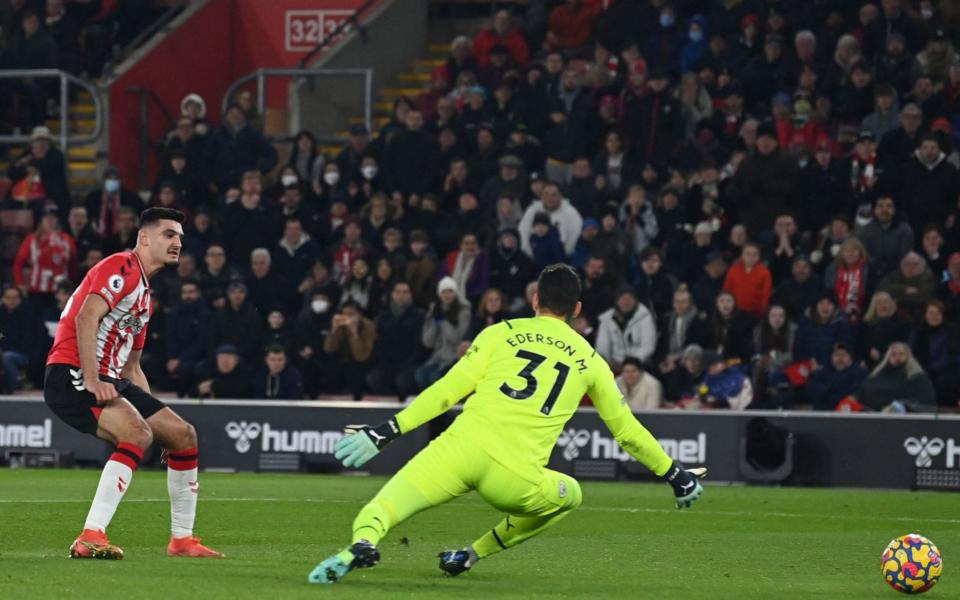 Southampton's English-born Albanian striker Armando Broja (L) shoots past Manchester City's Brazilian goalkeeper Ederson (R) but is flagged offside - GLYN KIRK/AFP via Getty Images