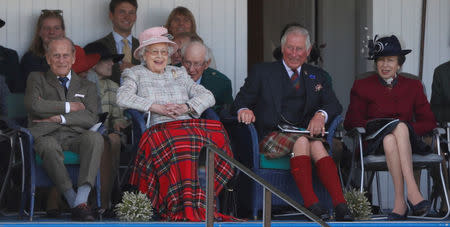 FILE PHOTO: Britain's Prince Phillip, The Queen, Prince Charles and Princess Anne watch the sack race at the Braemar Highland Gathering in Braemar, Scotland, Britain September 2, 2017. REUTERS/Russell Cheyne/File Photo