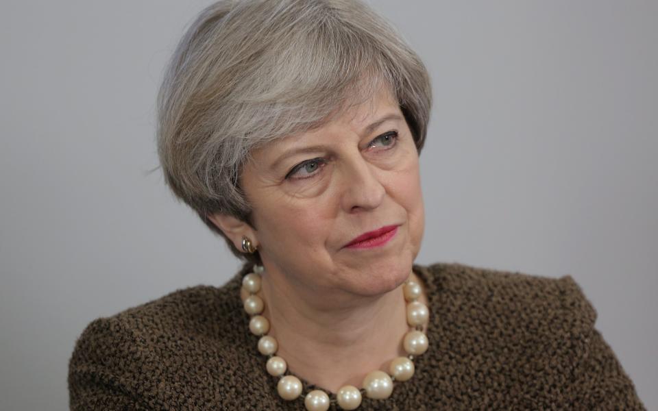 Theresa May talks to media after signing of the Swansea Bay City Region deal - Credit: EPA