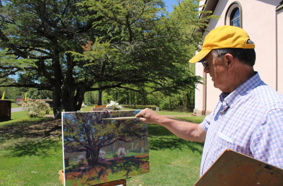 Along the 5&Dime Trail in Prince George County, Plein Air artist Ed Hatch paints a tree at Martin’s Brandon Church, a Virginia Historic Landmark, during the Petersburg: Prince George County Historic Garden Week tour hosted by the Petersburg Garden Club on Tuesday, April 18.