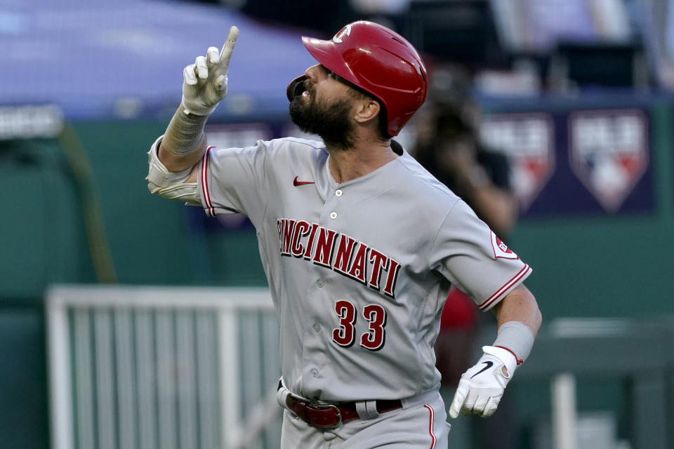 Cincinnati Reds' Jesse Winker celebrates after hitting a two-run home run against the Kansas City Royals during the third inning of the second game of baseball doubleheader Wednesday, Aug. 19, 2020, in Kansas City, Mo. (AP Photo/Charlie Riedel)