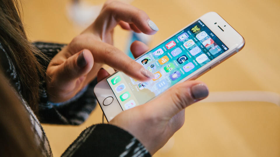 woman using Apple iPhone