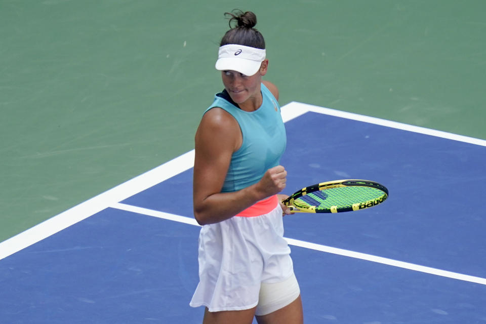 Jennifer Brady pumps her fist on the US Open court.