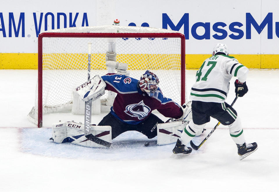 Colorado Avalanche goalie Philipp Grubauer (31) is scored against by Dallas Stars' Alexander Radulov (47) during first-period NHL Western Conference Stanley Cup playoff hockey game action in Edmonton, Alberta, Saturday, Aug. 22, 2020. (Jason Franson/The Canadian Press via AP)