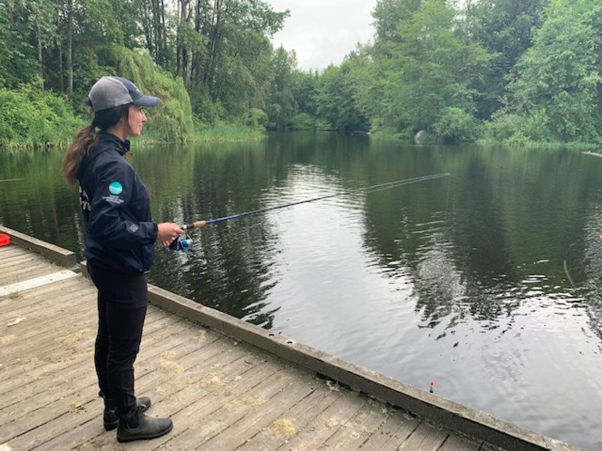 During B.C.'s Family Fishing Weekend, anglers and families are invited to fish for free from June 17 to 19. Marleau Brown of the Freshwater Fisheries Society of B.C. said Sanctuary Pond in Hastings Pond is kept stocked with rainbow trout. (Lisa Christiansen/CBC - image credit)