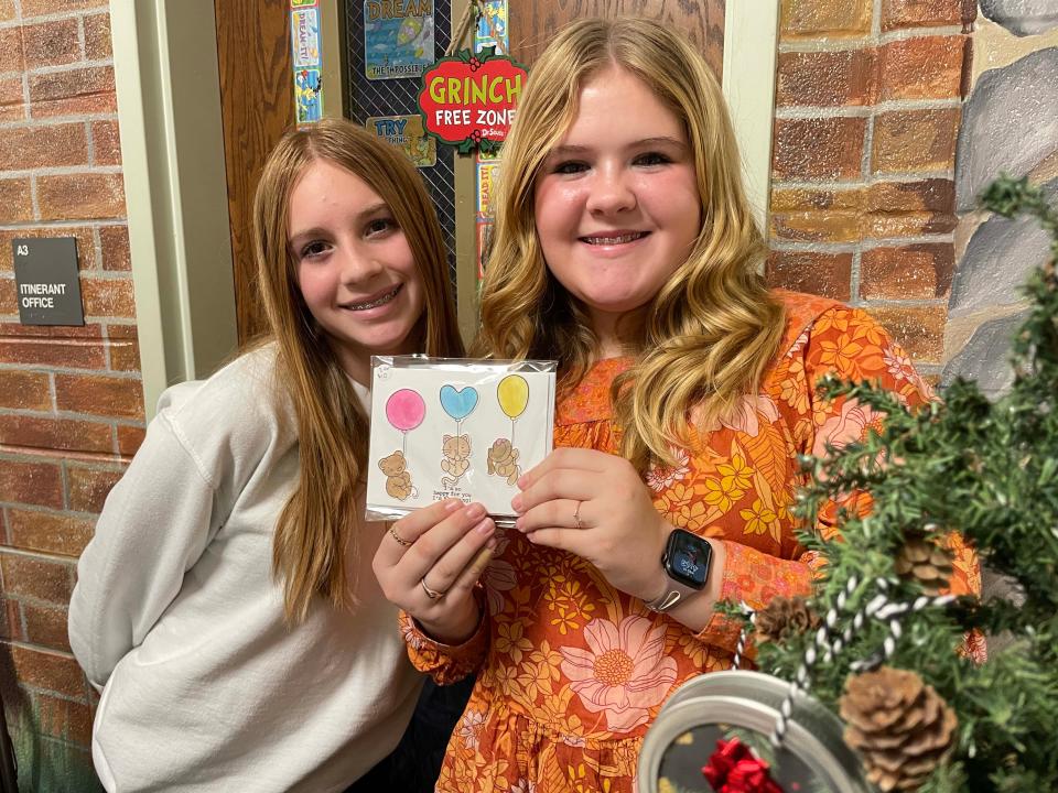 Reagan Chitty, 13, and Harmony Jaccard, 12, started their own stationery business with Emily Wright, 13, (not pictured) for the Holiday Market.